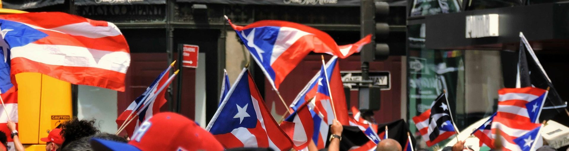 puerto rican flags being waved at parade